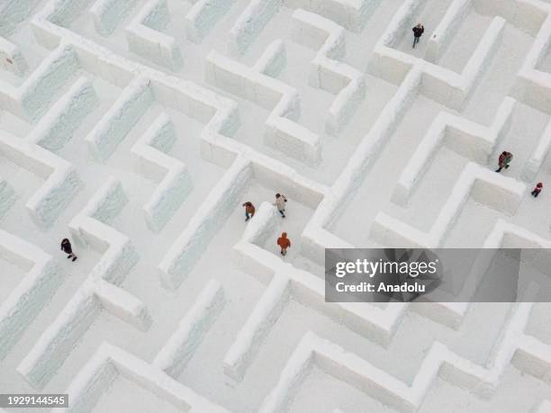 An aerial view of people trying to find the way out in the biggest snow maze in the world in Zakopane, Poland, January 15, 2024. The snow maze idea...