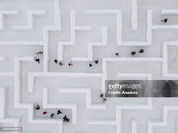 An aerial view of people trying to find the way out in the biggest snow maze in the world in Zakopane, Poland, January 15, 2024. The snow maze idea...