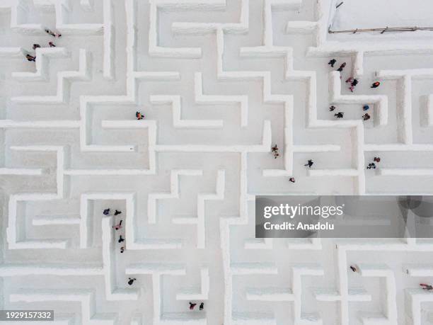 An aerial view of people trying to find the way out in the biggest snow maze in the world in Zakopane, Poland, January 15, 2024. The snow maze idea...