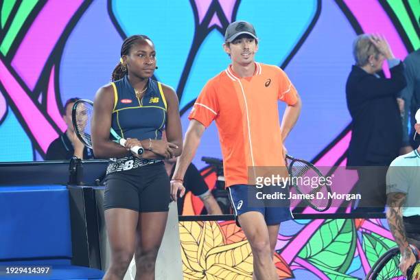 Coco Gauff of the United States with Alex de Minaur of Australia during the Kids Tennis Day Arena Spectacular ahead of the 2024 Australian Open at...