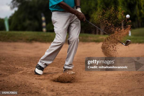 golfer in a sand trap - golf club stock pictures, royalty-free photos & images