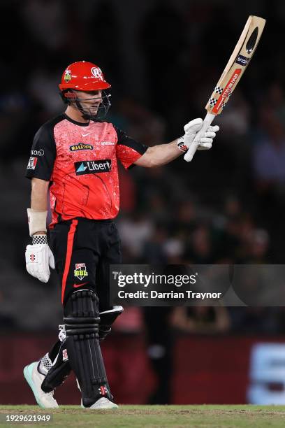 Shaun Marsh of the Renegades raises his bat after scoring 50 runs during the BBL match between Melbourne Renegades and Melbourne Stars at Marvel...