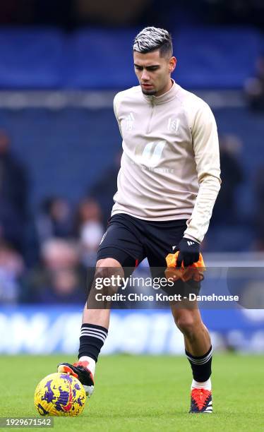 Andreas Pereira of Fulham FC warms up ahead of the Premier League match between Chelsea FC and Fulham FC at Stamford Bridge on January 13, 2024 in...