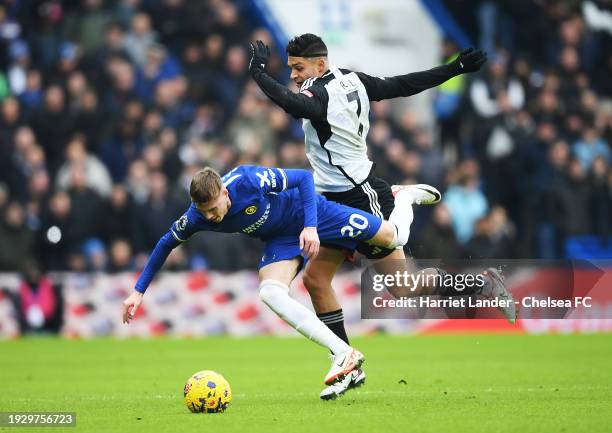 Cole Palmer of Chelsea is challenged by Raul Jimenez of Fulham during the Premier League match between Chelsea FC and Fulham FC at Stamford Bridge on...