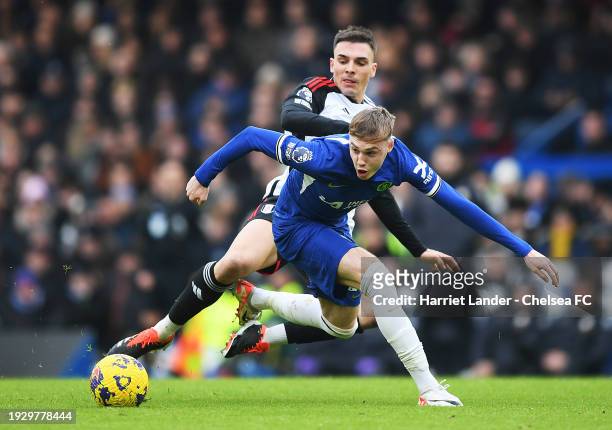 Cole Palmer of Chelsea is tackled by Joao Palhinha of Fulham during the Premier League match between Chelsea FC and Fulham FC at Stamford Bridge on...