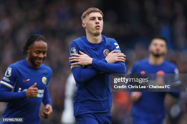 Cole Palmer of Chelsea celebrates after scoring their sides first goal from the penalty spot during the Premier League match between Chelsea FC and...