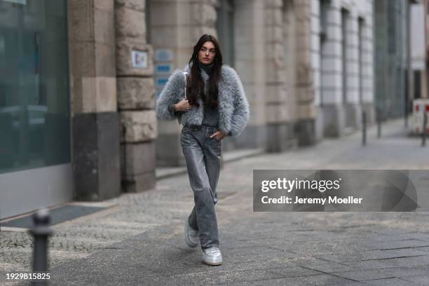 Celine Bethmann seen wearing silver earrings, Zara dark grey high neck wool knit sweater, Zara grey glitter pattern / rhinestone pattern straight leg...