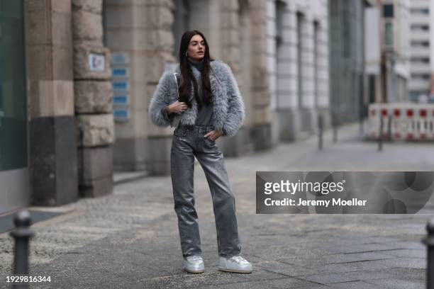 Celine Bethmann seen wearing silver earrings, Zara dark grey high neck wool knit sweater, Zara grey glitter pattern / rhinestone pattern straight leg...