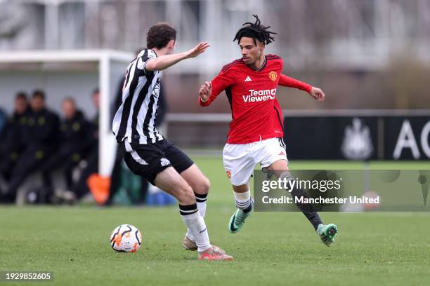 Ethan Williams of Manchester United U18 runs with the ball during the U18 Premier League match between Newcastle United U18 and Manchester United U18...