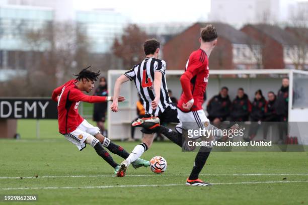 Ethan Williams of Manchester United U18 scores his team's first goal during the U18 Premier League match between Newcastle United U18 and Manchester...