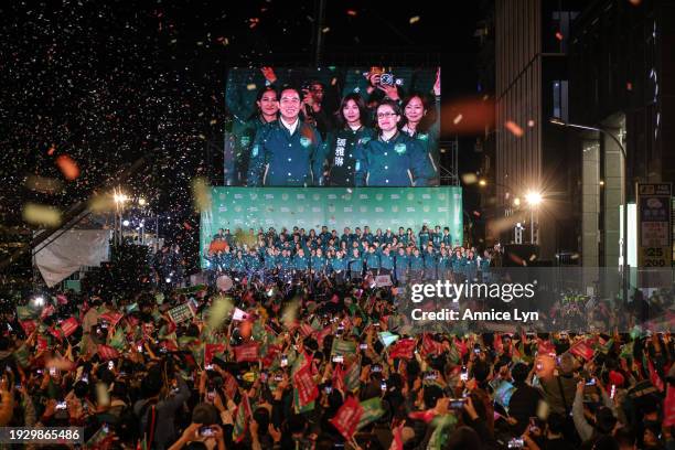 Confetti flies over the stage and crowd as Taiwan's Vice President and presidential-elect from the Democratic Progressive Party Lai Ching-te and his...