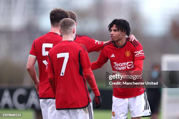 Ethan Williams of Manchester United U18 celebrates scoring his team's first goal with teammates during the U18 Premier League match between Newcastle...