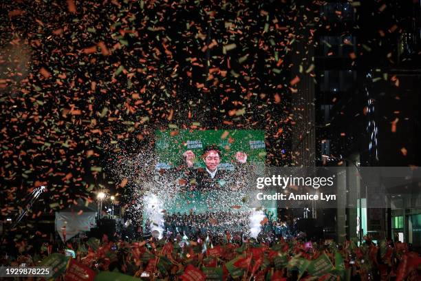 Confetti flies over the stage and crowd as Taiwan's Vice President and presidential-elect from the Democratic Progressive Party Lai Ching-te and his...