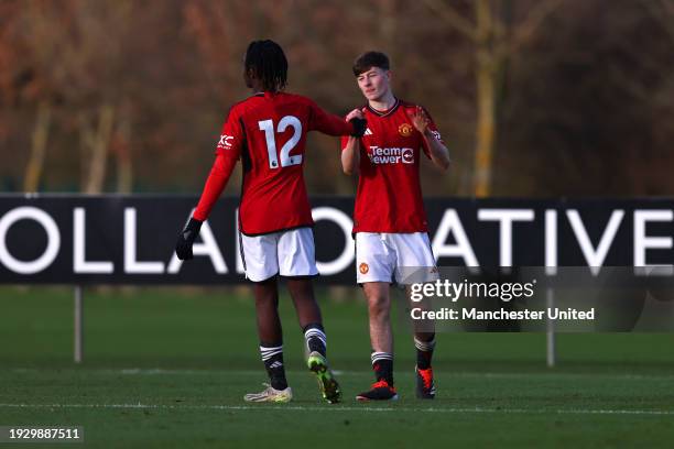 Jayce Fitzgerald of Manchester United U18 celebrates scoring his team's third goal with teammate Jaydan Kamason during the U18 Premier League match...
