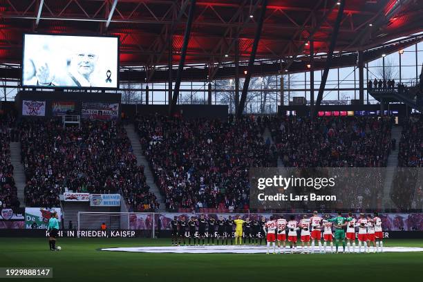 The players, match officials and fans pause for a minutes silence after the passing of former German football player and manager, Franz Beckenbauer,...