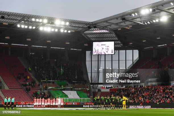 The players and fans pause for a minutes silence after the passing of former German football player and manager, Franz Beckenbauer, prior to kick-off...