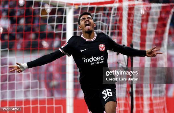 Ansgar Knauff of Eintracht Frankfurt celebrates after scoring their sides first goal during the Bundesliga match between RB Leipzig and Eintracht...