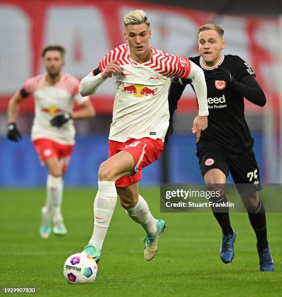 Benjamin Sesko of RB Leipzig runs ahead of Donny van de Beek of Eintracht Frankfurt during the Bundesliga match between RB Leipzig and Eintracht...