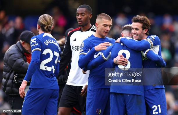 Alfie Gilchrist, Enzo Fernandez and Ben Chilwell of Chelsea celebrate following their sides victory after the Premier League match between Chelsea FC...