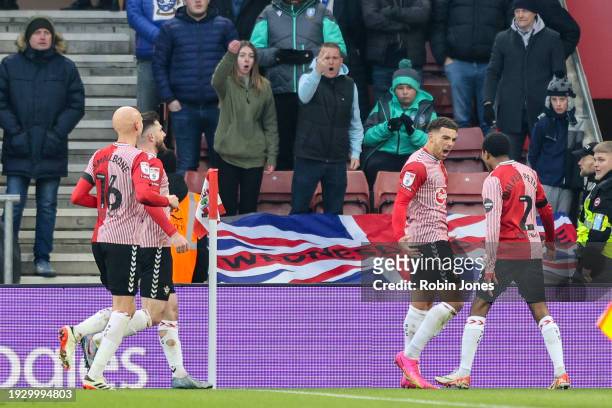 Former Sheffield United player Che Adams of Southampton celebrates in front of Wednesday fans after he scores a goal to make it 1-0 with team-mate...