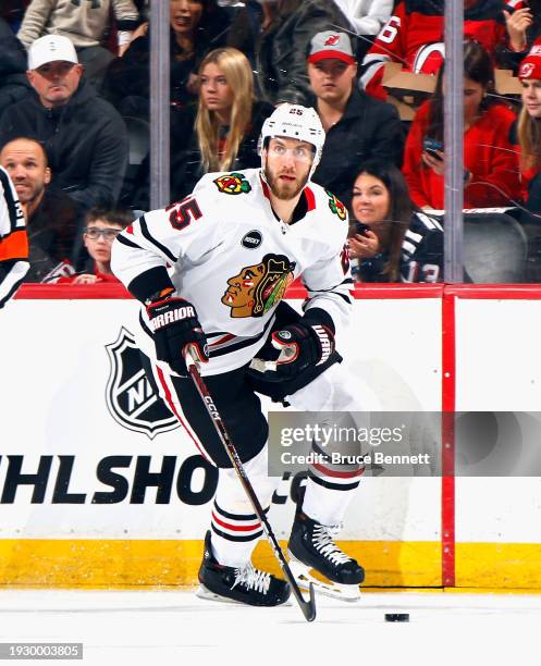 Jarred Tinordi of the Chicago Blackhawks skates against the New Jersey Devils at Prudential Center on January 05, 2024 in Newark, New Jersey.