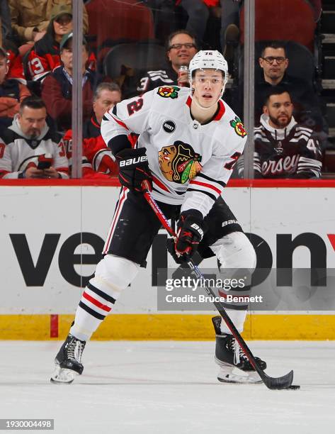 Alex Vlasic of the Chicago Blackhawks skates against the New Jersey Devils at Prudential Center on January 05, 2024 in Newark, New Jersey.