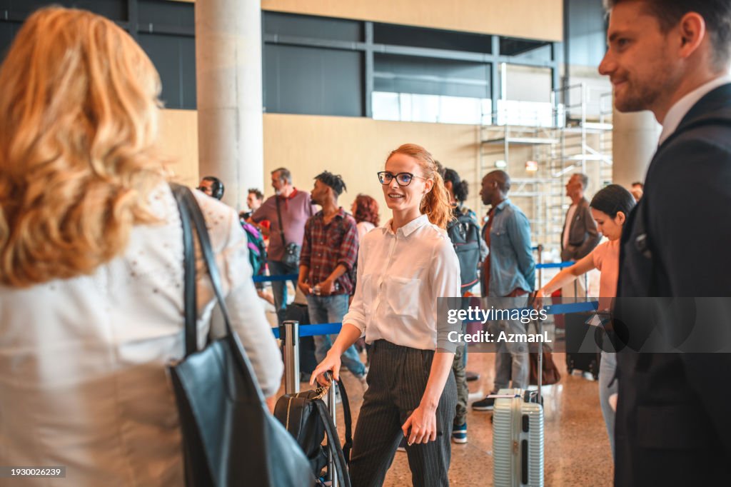 In Person Check In Diverse Group Of People In A Check In Line At The Airport High-Res ...