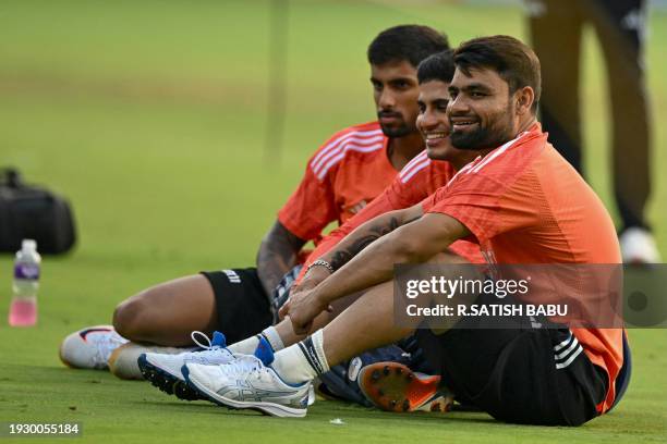 India's Rinku Singh , Shubman Gill and Tilak Varma attend a practice session at the M. Chinnaswamy Stadium in Bengaluru on January 16 on the eve of...