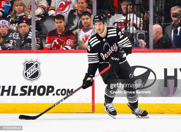 Colin Miller of the New Jersey Devils skates against the Vancouver Canucks at Prudential Center on January 06, 2024 in Newark, New Jersey.