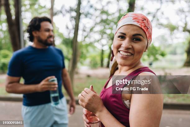 portrait of a mature woman who is battling at park - survival stock pictures, royalty-free photos & images