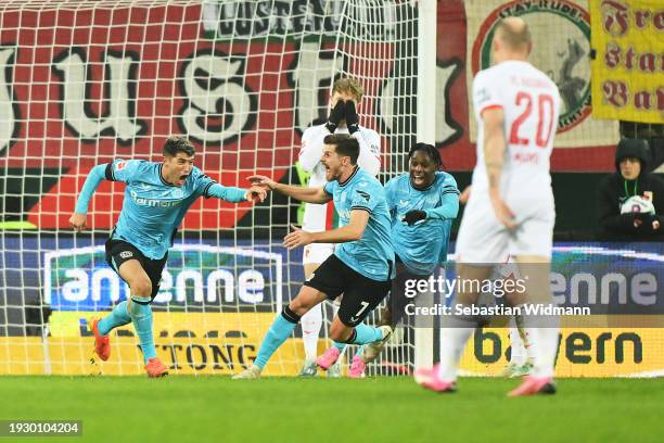 Exequiel Palacios of Bayer Leverkusen celebrates scoring his team's first goal during the Bundesliga match between FC Augsburg and Bayer 04...