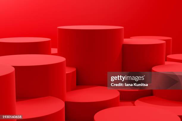 bright red 3d cylinders pattern, abstract background. design element. geometric composition. - red pedestal stock pictures, royalty-free photos & images