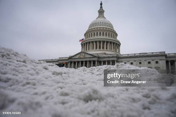 Plowed snow is piled up on the plaza of the U.S. Capitol January 16, 2024 in Washington, DC. The Senate returns on Tuesday to begin work on a stopgap...