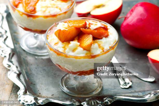coconut rice pudding with caramelized apples - red delicious apple stock pictures, royalty-free photos & images