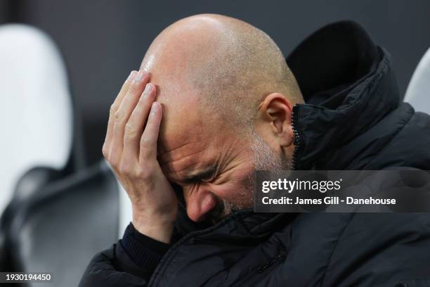 Josep 'Pep' Guardiola, manager of Manchester City, looks dejected during the Premier League match between Newcastle United and Manchester City at St....