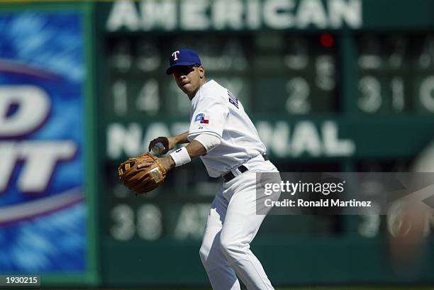 Shortstop Alex Rodriguez of the Texas Rangers makes the throw to first after fielding the ball against the Seattle Mariners at the Ballpark in...