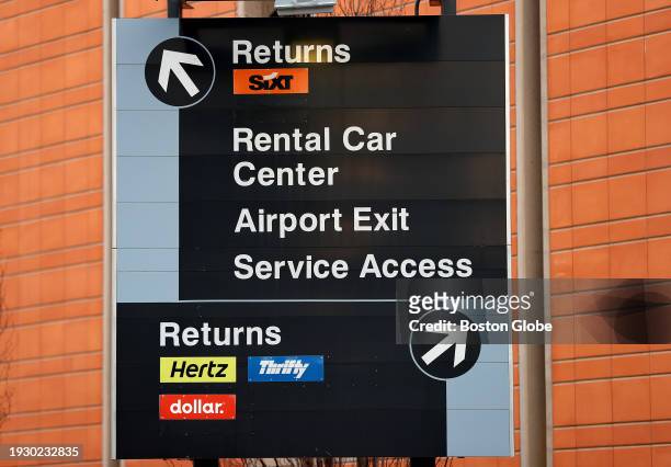 Boston, MA A sign at Logan Airport points the way to rental car services.