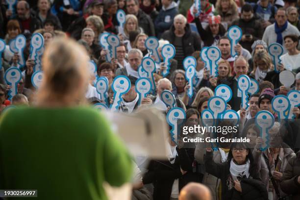 Relatives of Basque prisoners holding cardboard keys attend the final speech during a demonstration organized by the asociation Sare demanding the...