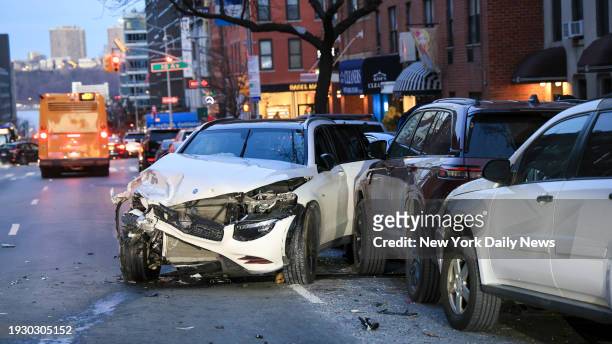 January 15: NYPD Midtown North Precinct officers investigate a multiple car accident involving a brand new Mercedes AMG GLC 43 with temporary Texas...