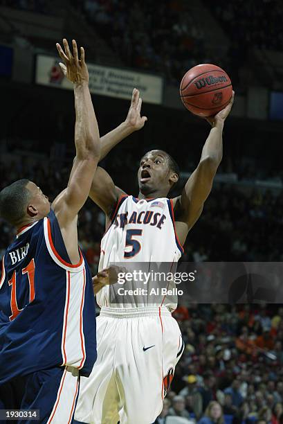 Josh Pace of the Syracuse Orangemen shoots over Derrick Bird of the Auburn Tigers during the East Regionals of the NCAA Championship on March 28,...