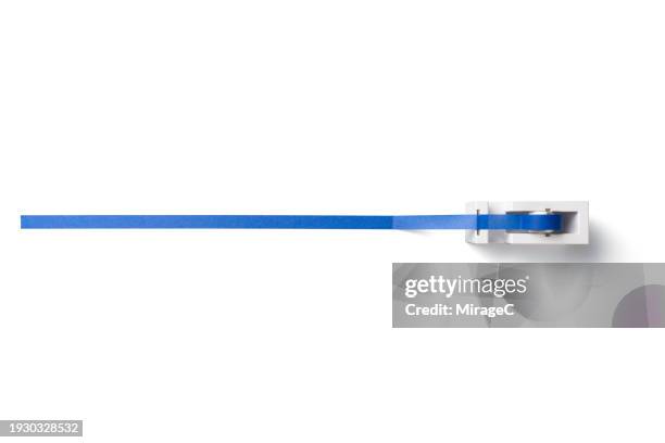 long piece of adhesive tape from tape dispenser on white - länge stock-fotos und bilder
