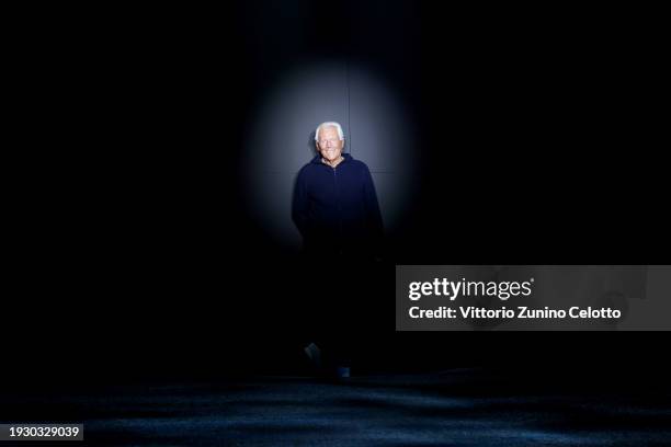Fashion designer Giorgio Armani acknowledges the applause of the audience at the Emporio Armani fashion show during the Milan Menswear Fall/Winter...