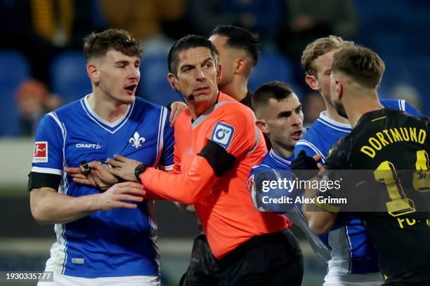 Scuffle breaks out between Matej Maglica of SV Darmstadt 98 and Niclas Fuellkrug of Borussia Dortmund during the Bundesliga match between SV...