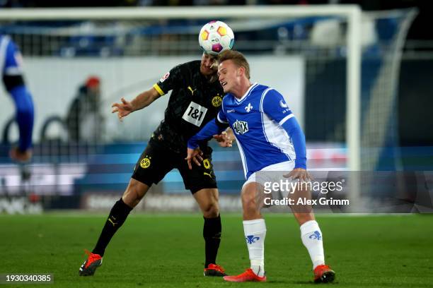 Salih Ozcan of Borussia Dortmund battles for possession with Oscar Vilhelmsson of SV Darmstadt 98 during the Bundesliga match between SV Darmstadt 98...