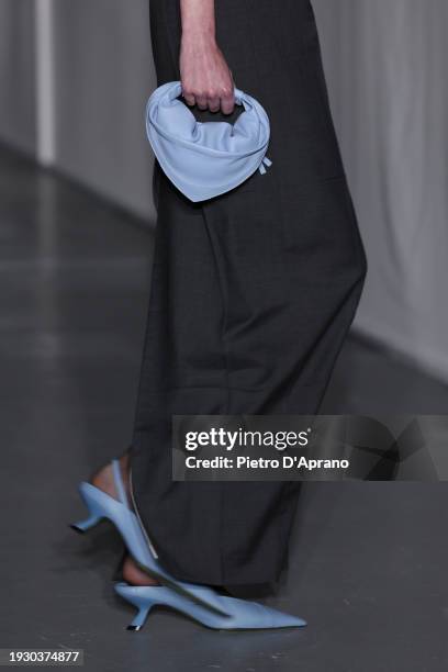 Model, bag detail, walks the runway at the Federico Cina fashion show during the Milan Menswear Fall/Winter 2024-2025 on January 13, 2024 in Milan,...