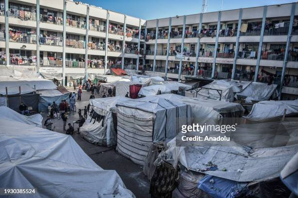 General view of the school building and tents as Palestinians, who left their homes to survive due to Israeli attacks, took shelter in a United...