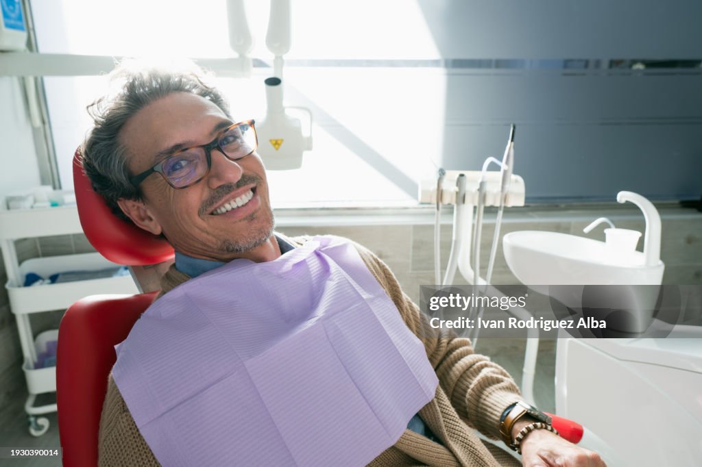 Satisfied man smiling after a dental procedure