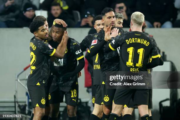 Youssoufa Moukoko of Borussia Dortmund celebrates scoring his team's third goal with teammates during the Bundesliga match between SV Darmstadt 98...