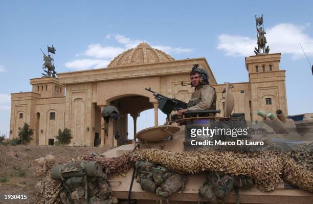 Marine sits on his light armored viechcle in front of Saddam Hussein Palace April 14, 2003 in Tikrit which is located approximately 175 km north of...