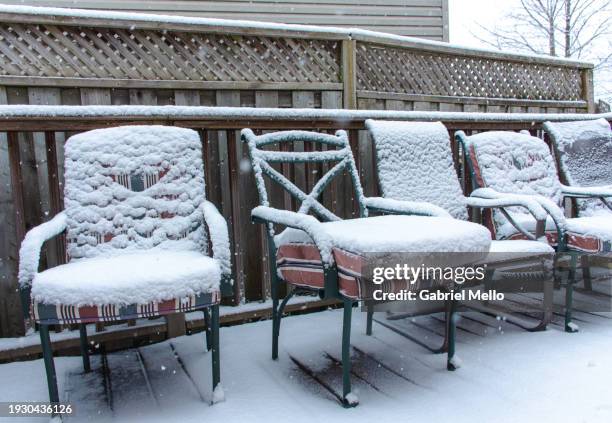 backyard chairs covered in snow - backyard patio winter stock pictures, royalty-free photos & images